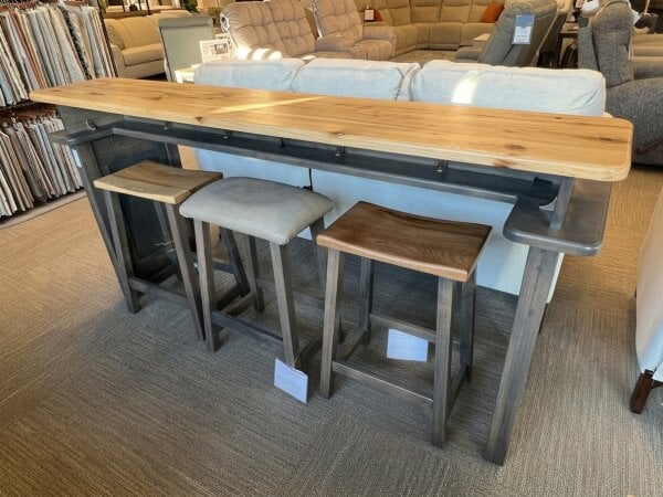 Wooden sofa bar table with three different style bar stools.